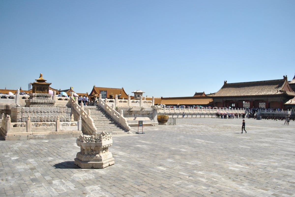 wide marble courtyard of the Forbidden City with the Hall of Supreme Harmony on its triple-tiered terrace