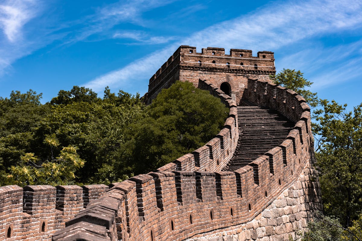 A Ming-era watchtower at Mutianyu seen from the wall walk in autumn light