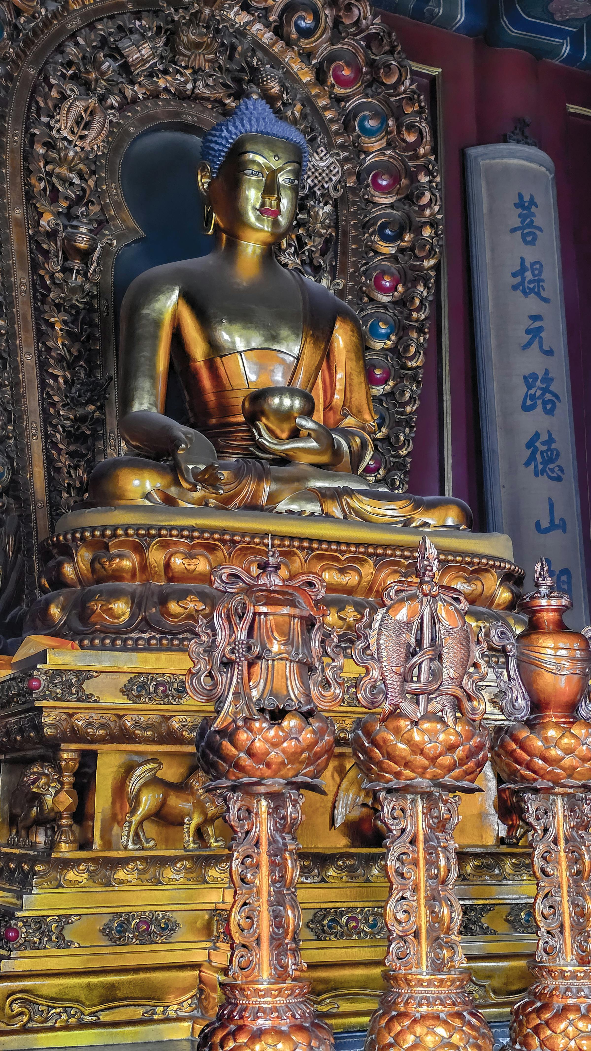 Detail of Tibetan Buddhist statuary inside one of the Lama Temple halls