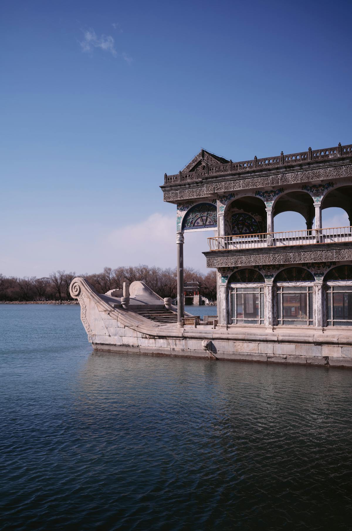 The Marble Boat at the Summer Palace, a stone pleasure barge moored at the lake's edge